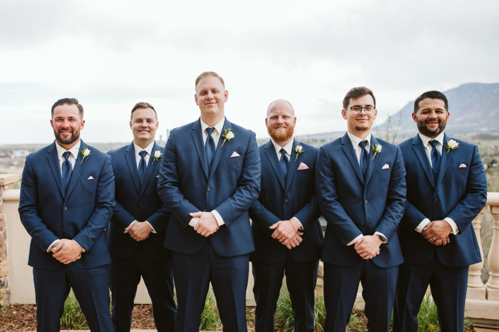 Groomsmen in matching blue suits